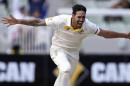 Australia's Mitchell Johnson celebrates taking the wicket of India's Cheteshwar Pujara for 21 runs on the final day of their cricket test match in Melbourne, Australia, Tuesday, Dec. 30, 2014. (AP Photo/Andy Brownbill)