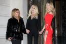From left, Goldie Hawn, Italian fashion designer Donatella Versace and Kate Hudson pose as they arrive for the show of the Atelier Versace Spring-Summer 2015 Haute Couture fashion collection presented in Paris, France, Sunday, Jan. 25, 2015. (AP Photo/Thibault Camus)