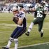 New England Patriots' Wes Welker (83) catches a pass for a touchdown in front of New York Jets defensive back Ellis Lankster (26) during the first half of an NFL football game, Thursday, Nov. 22, 2012, in East Rutherford, N.J. (AP Photo/Bill Kostroun)