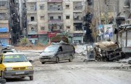 A van loaded with household goods flees a district close to the front line between Syrian rebels and pro-government troops in the city of Aleppo
