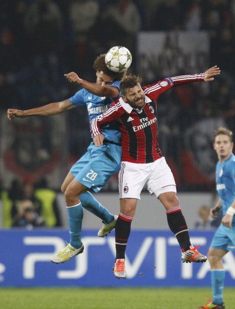 Zenit St. Petersburg's Witsel fights for the ball with AC Milan's Nocerino during their Champion's league Group C soccer match in St. Petersburg's Petrovsky Stadium