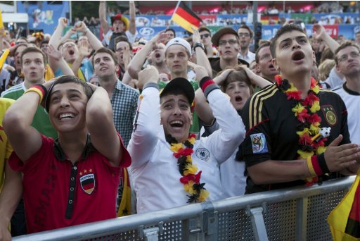 Germany supporters watch Germany play Portugal during Euro 2012 soccer match at the Fan Mile in Berlin
