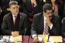 Venezuela's President Nicolas Maduro and his Foreign Affairs Minister Elias Jaua participate in the Mercosur trade bloc and special guests summit during the bloc summit in Montevideo