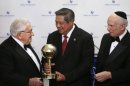 President Susilo Bambang Yudhoyono of Indonesia, center, is presented with a World Statesman Award by former Secretary of State Henry Kissinger, left, and Appeal of Conscience Foundation President Rabbi Arthur Schneier, right, Thursday, May 30, 2013 in New York. (AP Photo/Jason DeCrow)