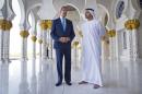 Standing without shoes as a sign of respect in the mosque, U.S. Secretary of State John Kerry, left, and Emirati Foreign Minister Abdullah bin Zayed Al Nahyan speak to the media after touring the Sheikh Zayed Grand Mosque in Abu Dhabi, United Arab Emirates, on Monday, Nov. 23, 2015. (AP Photo/Jacquelyn Martin, Pool)