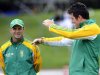 South Africa's captain Smith talks to coach Kirsten as rain delays the start of play against New Zealand in the third and final international test cricket match of the series in Wellington