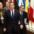 British Prime Minister David Cameron, center, departs after an EU summit in Brussels on Friday, Nov. 23, 2012. The leaders of Britain and France staked out starkly different visions of Europe's future as talks in Brussels on how much the European Union should be allowed to spend, set the stage for a long, divisive and possibly inconclusive summit. (AP Photo/Geert Vanden Wijngaert)
