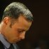Olympic athlete Oscar Pistorius stands during his bail hearing at the magistrate court in Pretoria, South Africa, Thursday, Feb. 21, 2013. The lead investigator in the murder case against Pistorius faces attempted murder charges himself over a 2011 shooting, police said Thursday in another potentially damaging blow to the prosecution. Prosecutors said they were unaware of the charges against veteran detective Hilton Botha when they put him on the stand in court to explain why Pistorius should not be given bail in the Valentine's Day shooting death of his girlfriend. (AP Photo/Themba Hadebe)