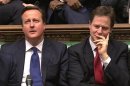 Britain's Prime Minister David Cameron and Deputy Prime Minister Nick Clegg listen to the opposition after Chancellor of the Exchequer George Osborne delivered the autumn budget in parliament in London