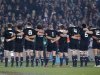 The All Blacks link arms as they sing the national anthem for their test against Ireland at Eden Park in Auckland