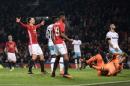 Manchester United's Swedish striker Zlatan Ibrahimovic (L) celebrates scoring histeam's fourth goal against West Ham United at Old Trafford in Manchester, north west England, on November 30, 2016