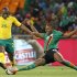 Zambia's Stoppila Sunzu challenges Tokelo Rantie of South Africa during the Nelson Mandela Challenge at Soccer city outside Soweto