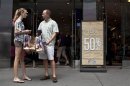 Shoppers are seen outside an Aeropostale store in Time Square in New York