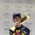 Red Bull Formula One driver Vettel kisses his trophy after the podium ceremony of the South Korean F1 Grand Prix at the Korea International Circuit in Yeongam