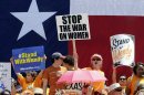 Pro-abortion rights supporters cheer during a rally outside the Texas capitol, Monday, July 1, 2013, in Austin, Texas. The Texas Senate has convened for a new 30-day special session to take up contentious abortion restrictions bill and other issues. (AP Photo/Eric Gay)