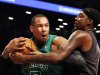 Boston Celtics forward Jared Sullinger (7) and Brooklyn Nets forward-center Andray Blatche (0) battle for the ball in the first half of their NBA basketball game at the Barclays Center, Tuesday, Dec. 25, 2012, in New York. (AP Photo/John Minchillo)