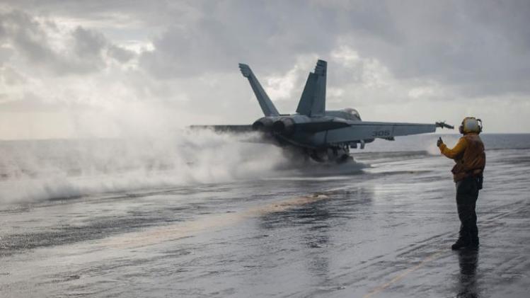 This US Navy photo shows an F-18 as it launches from the flight deck of the US.Navy&#39;s forward-deployed aircraft carrier USS George Washington (CVN 73)in the South China Sea on November 14, 2013