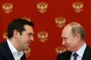 Greek Prime Minister Alexis Tsipras (L) speaks with Russian President Vladimir Putin during a signing ceremony at the Kremlin in Moscow on April 8, 2015