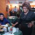 FILE- In this Jan. 17, 1996 file photo, the Self-described "Queen of Soul Food" Sylvia Woods, right, greets patron Carrie Haynes-Madsen at her restaurant, “Sylvia's,” in the Harlem neighborhood of New York. Wood died in Mount Vernon, N.Y. on Thursday, July 19, 2012. She was 86. (AP Photo/Kathy Willens, File)
