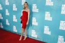 Actress Charlize Theron arrives at the 2012 MTV Movie Awards in Los Angeles