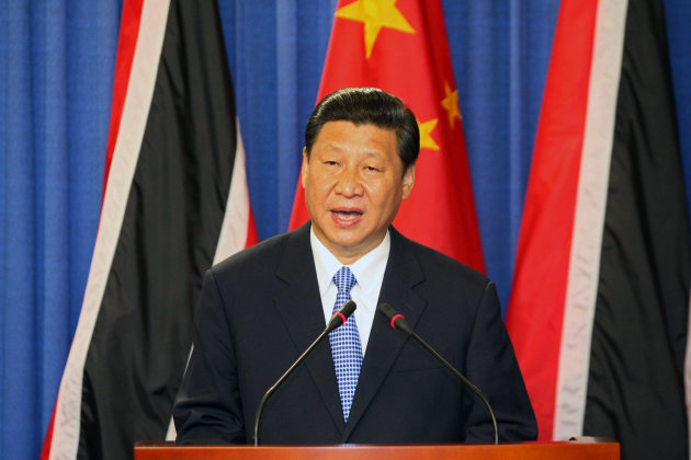 China's President Xi Jinping speaks during a joint news conference with Trinidad & Tobago's Prime Minister Kamla Persad-Bissessar, unseen, at the Diplomatic Center in St. Ann's, Trinidad, Saturday, June 1, 2013. Xi Jinping announced China was awarding Trinidad a $250 million loan to build a children's hospital during the first stop of his four-country regional tour in the Americas. He's also traveling to Mexico, Costa Rica and the U.S. (AP Photo/Anthony Harris)