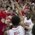 Arkansas' Jacorey Williams, right, and Anthlon Bell celebrate with fans after their 80-69 win over No. 2 Florida in an NCAA college basketball game in Fayetteville, Ark., Tuesday, Feb. 5, 2013. (AP Photo/Gareth Patterson)