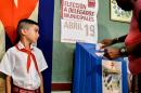 A woman casts her vote at a polling station in Nautico neighbourhood in Havana, Cuba, on April 19, 2015, during municipal elections