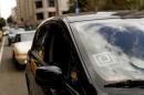 Uber logo is seen on a vehicle near Union Square in San Francisco, California
