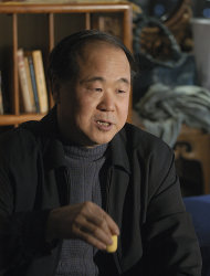 In this photo taken on Tuesday, Dec. 27, 2005, Chinese writer Mo Yan reacts during an interview in Beijing, China. Mo won the Nobel Prize in literature on Thursday, Oct. 11, 2012, a somewhat unexpected choice by a prize committee that has favored European authors in recent years. (AP Photo) CHINA OUT