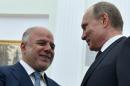 Russian President Vladimir Putin (right) greets Iraqi Prime Minister Haider al-Abadi during a meeting at the Kremlin in Moscow on May 21, 2015