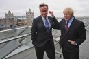 British Prime Minister David Cameron and London Mayor Boris Johnson, right, at City Hall, London, following Johnson's re-election as the Mayor of London Saturday May 5, 2012. London's comic and outspoken mayor Boris Johnson won re-election Friday, triumphing in a closer-than-expected vote to secure a second term and his status as the unvarnished and unpredictable host of the 2012 Olympics (AP Photo/Stefan Rousseau/PA Wire)