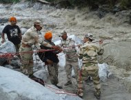 Indo-Tibetan Border Police prepare to get a flood evacuee across a raging river in Ghangaria on June 21, 2013. Rescuers have recovered scores of bodies from the swollen Ganges river with nearly 63,000 people, mainly pilgrims and tourists, still stranded or missing