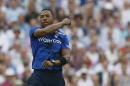 England's Chris Jordan celebrates taking the wicket of New Zealand's Grant Elliot during the one day international match at the Oval cricket ground in London, Friday, June 12, 2015. (AP Photo/Kirsty Wigglesworth)