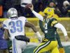 Green Bay Packers quarterback Aaron Rodgers breaks away from Detroit Lions' Ricardo Silva (39) for a 27-yard touchdown run during the second half of an NFL football game Sunday, Dec. 9, 2012, in Green Bay, Wis. (AP Photo/Jeffrey Phelps)