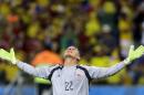 Colombia's goalkeeper Faryd Mondragon celebrates after Colombia's James Rodriguez scored his side's fourth goal during the group C World Cup soccer match between Japan and Colombia at the Arena Pantanal in Cuiaba, Brazil, Tuesday, June 24, 2014. (AP Photo/Kirsty Wigglesworth)