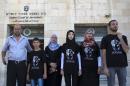The family of 16-year old Mohammed Abu Khder, who was kidnapped from east Jerusalem on July 2 and burned to death, stand outside the District Court in Jerusalem, on August 6, 2014