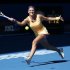 Victoria Azarenka of Belarus hits a return to Sloane Stephens of the U.S. during their women's singles semi-final match at the Australian Open tennis tournament in Melbourne