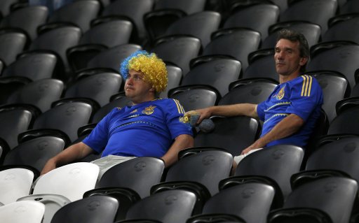 Fans of Ukraine react at the end of their Group D Euro 2012 soccer match against England at Donbass Arena in Donetsk