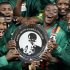 Zambia soccer players celebrate with the Nelson Mandela Challenge trophy after beating South Africa at Soccer city outside Soweto