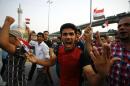 Iraqi protesters rally against corruption and poor services on August 7, 2015 in the holy city of Najaf