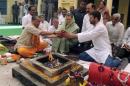 Sonia Gandhi and her son Rahul perform a religious ritual before Sonia filed her nomination for the upcoming general election at Rae Bareli