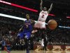 Chicago Bulls' Nate Robinson loses the ball as he goes to the basket against New York Knicks' J.R. Smith during the second half of their NBA game in Chicago