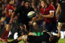 Scotland's Jonny Gray, right, is tackled by New Zealand's captain Richie McCaw, bottom, during the international rugby match at Murrayfield, Edinburgh, Scotland, Saturday Nov. 15, 2014. (AP Photo/Scott Heppell)