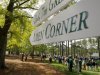 A sign points the way to the famed Amen Corner as patrons watch a practice round for the 2009 Masters golf tournament at the Augusta National Golf Club in Augusta