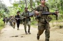 Philippine soldiers search for Abu Sayyaf extremists during a patrol of Basilan island