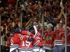 Chicago Blackhawks celebrate after right wing Patrick Kane scored a goal during the third period in Game 5 of the NHL hockey Stanley Cup playoffs Western Conference finals against the Los Angeles Kings, Saturday, June 8, 2013, in Chicago. (AP Photo/Nam Y. Huh)