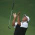 Cabrera of Argentina flips his putter after missing a birdie putt on the second playoff hole during the 2013 Masters golf tournament in Augusta