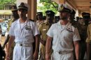 Italian marines Latore Massimiliano (2ndL) and Salvatore Girone are escorted by Indian police in Kollam