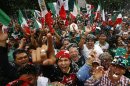 Fans of Mexico's soccer team celebrate after their team beat Brazil in the men's soccer final at the London 2012 Summer Olympics, below the Angel of Independence monument in Mexico City, Saturday, Aug. 11, 2012. Mexico won the match 2-1 and the gold.(AP Photo/Marco Ugarte)