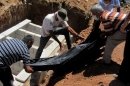This citizen journalism image provided by Shaam News Network SNN, taken on Thursday, Aug. 9, 2012, purports to show Syrians burying a body in Daraa, Syria. (AP Photo/Shaam News Network, SNN)THE ASSOCIATED PRESS IS UNABLE TO INDEPENDENTLY VERIFY THE AUTHENTICITY, CONTENT, LOCATION OR DATE OF THIS CITIZEN JOURNALIST IMAGE